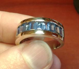 A ring with channel set aquamarine rectangles